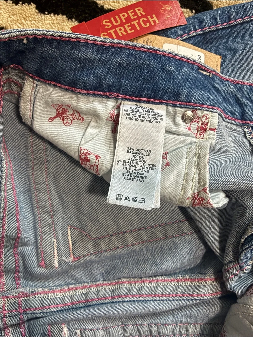 True Religion Mid-Blue Skinny Jeans with Pink Stitching